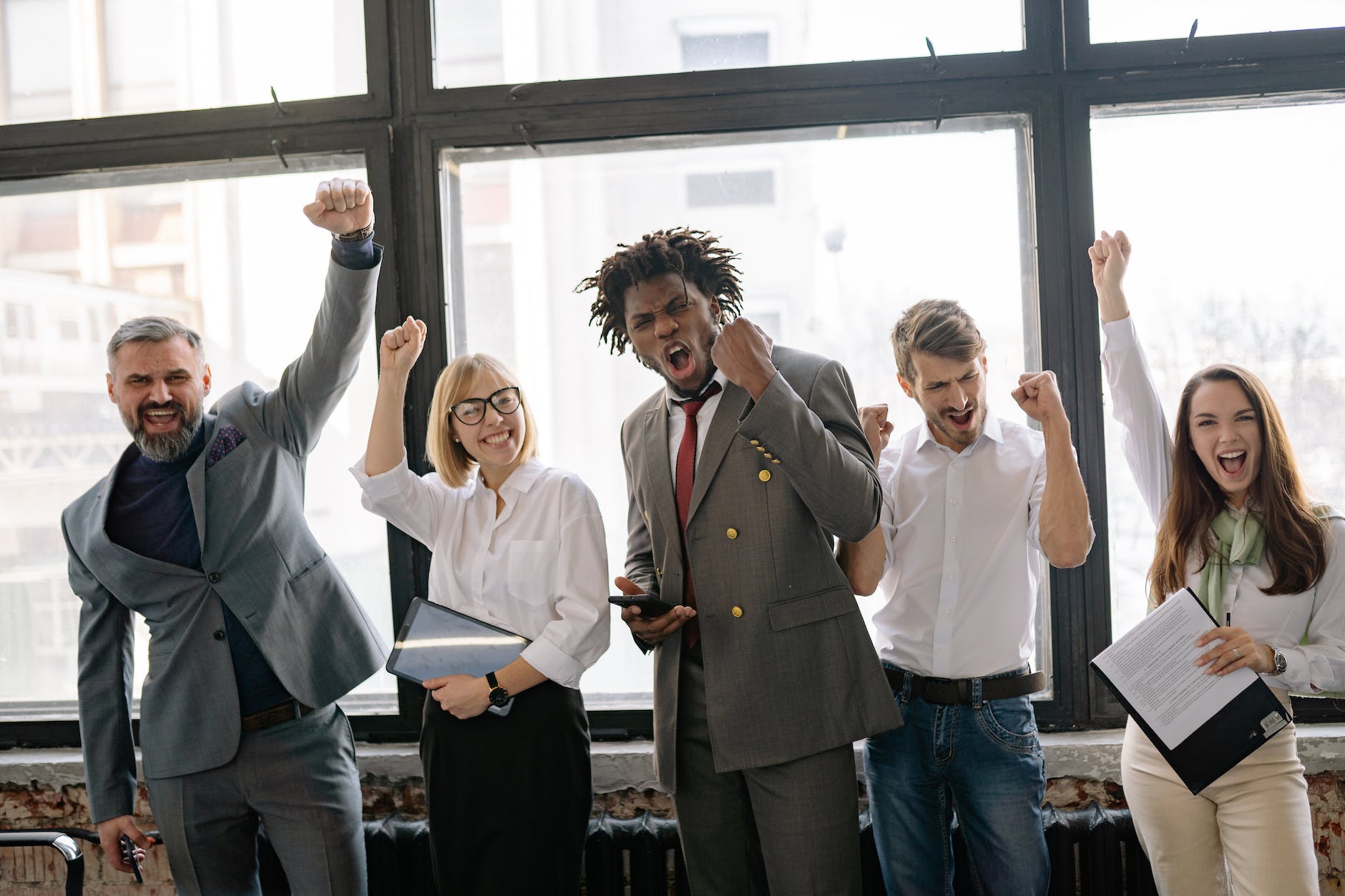 people celebrating at the office Photo by Yan Krukau on Pexels.com