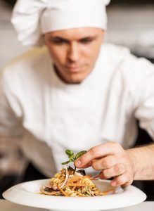 bigstock-Chef-Decorating-Pasta-Salad-Wi-47494984