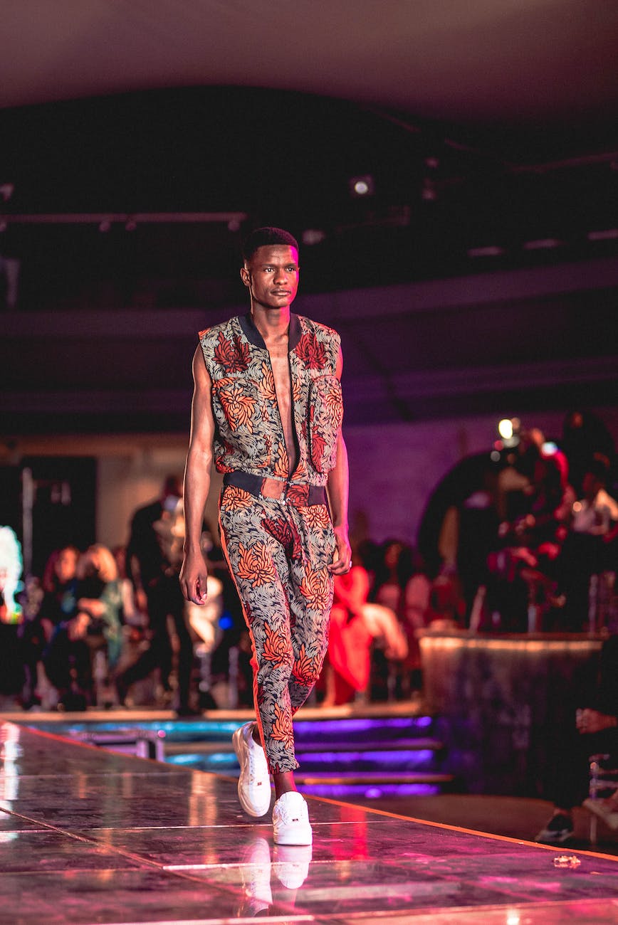 a man modeling on stage